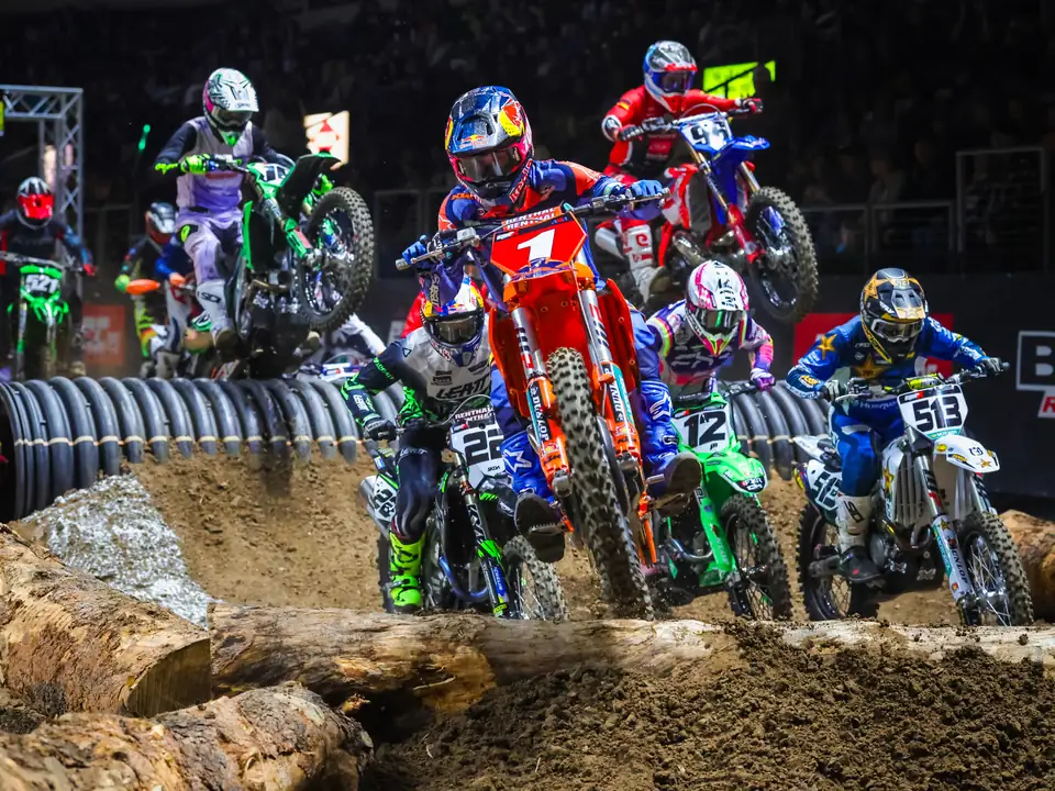 Riders battling up a rock face in the arena
