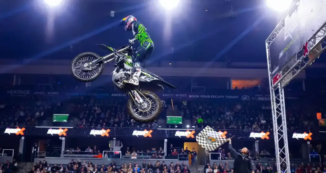 Rider airborne over the arena floor at an EnduroCross indoor round