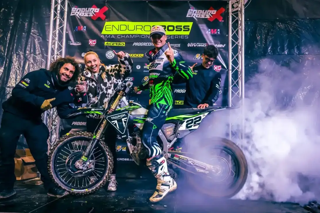 Rider celebrating on the podium at the EnduroCross season finale